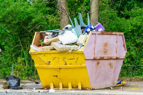 Professional house clearance team at work in a North West London home