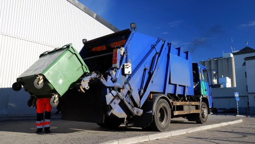 Queens Park waste clearance team removing debris