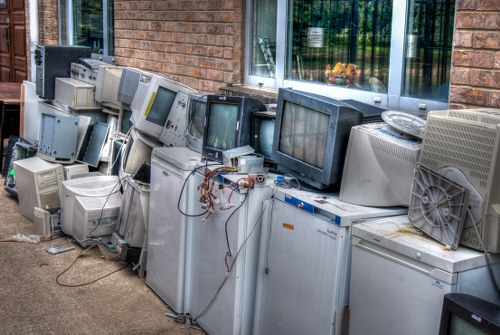 Professional home clearance team working in a North West London home